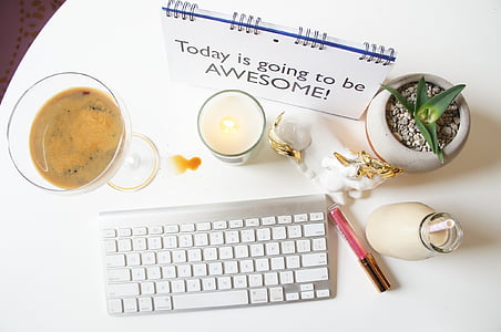 Apple Magic Keyboard on white wooden table top thumbnail