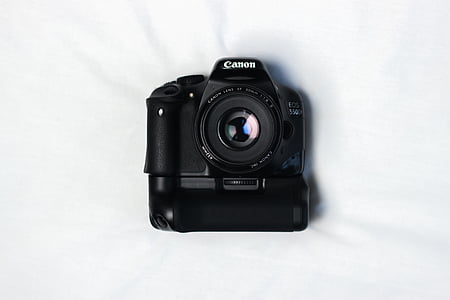 black Canon DSLR with battery grip thumbnail
