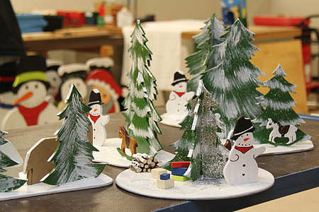 selective focus photography of snowman near pine tree table decor thumbnail