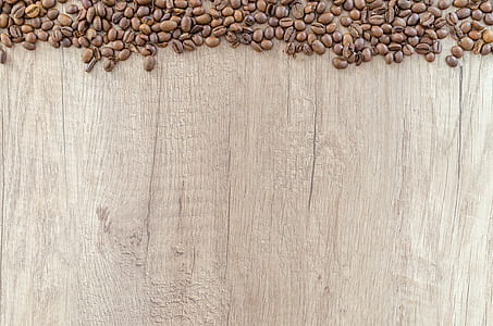 flat lay photography of coffee beans on wooden surface thumbnail