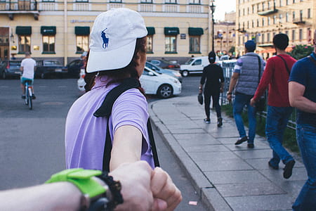 woman holding person walking on curb street thumbnail
