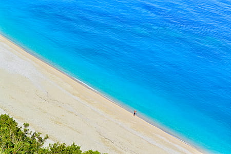 person standing on seashore thumbnail