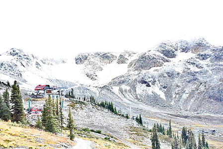 houses beside mountain with snow thumbnail