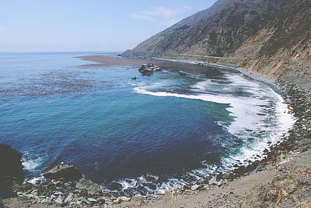 aerial photography of sea and mountain thumbnail