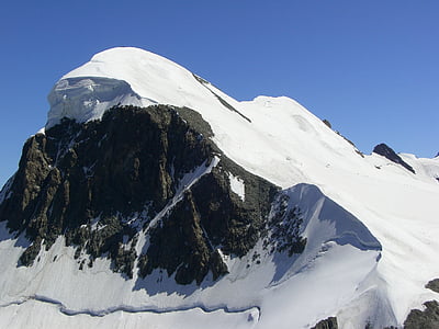 snow studded grey mountain thumbnail