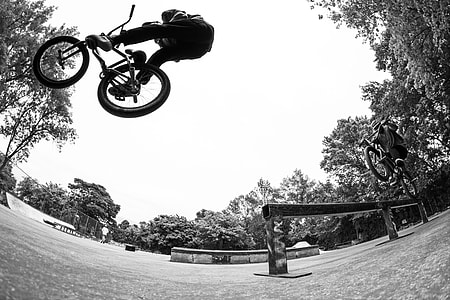 low-angle photography of person riding bicycle thumbnail