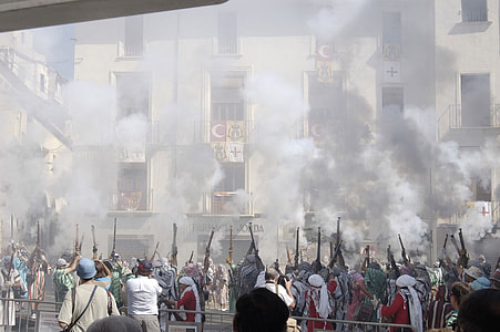 group of people holding and firing guns thumbnail