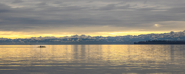 body of water under cloudy sky thumbnail