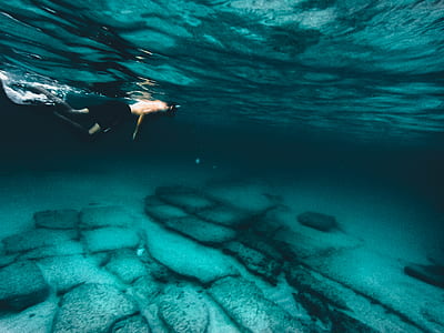 person snorkeling on clear blue lagoon thumbnail