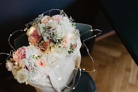 Bouquet of flowers in a bag with some fairy lights thumbnail