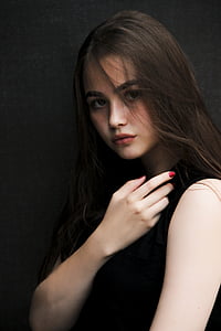 woman wearing black sleeveless dress thumbnail