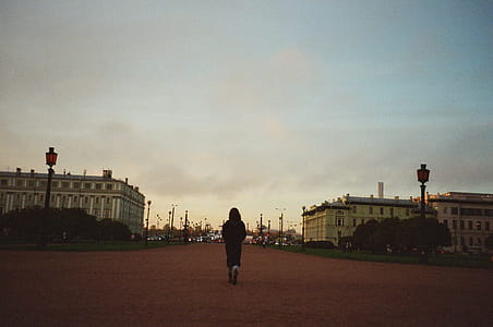 Woman Walking Towards City thumbnail