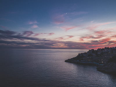 seaside town during nighttime thumbnail