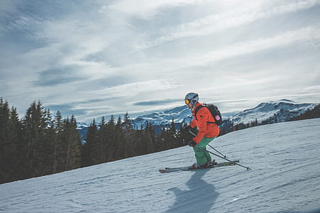 man skiing under cloudy sky thumbnail