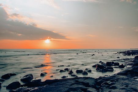 photo of boulders near body of water thumbnail