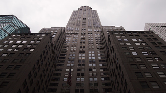 worm view of building under dark clouds thumbnail