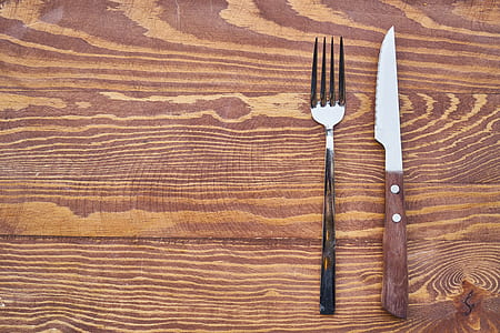 silver fork and knife on table thumbnail
