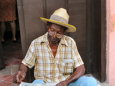 man reads newspaper thumbnail