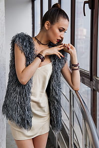 woman wearing gray fur vest thumbnail