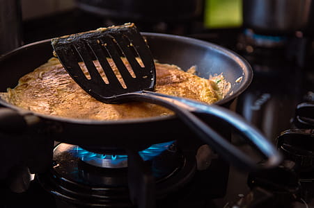 Black Spatula On Black Frying Pan thumbnail