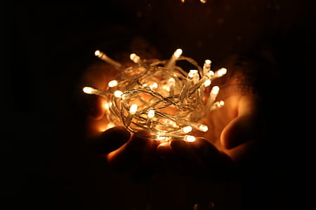 Person Showing White String Lights during Nightime thumbnail