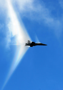 black biplane above blue and white sky at daytime thumbnail