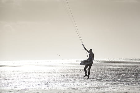 Person With Parachute Strings Grayscale Photo thumbnail