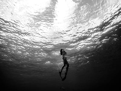grayscale photography of woman underwater thumbnail