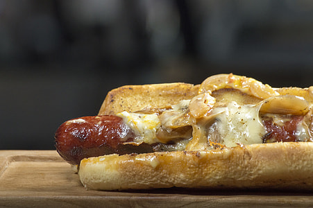 close-up photo of hotdog in bun with cheese thumbnail