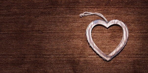 silver heart decor on brown surface thumbnail