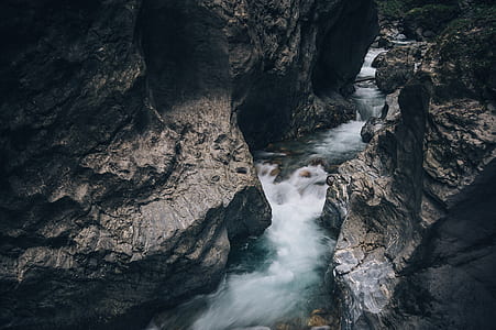 time lapse photography of river between rocky formation thumbnail