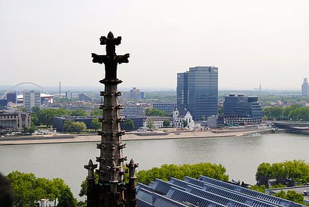 brown concrete building near body of water during daytime thumbnail