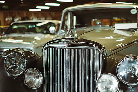 selective focus photography of classic beige vehicle thumbnail