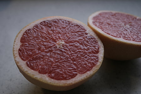 sliced yellow lemon on white surface thumbnail