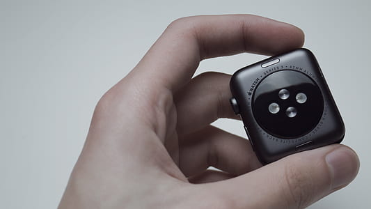 person holding Apple watch thumbnail