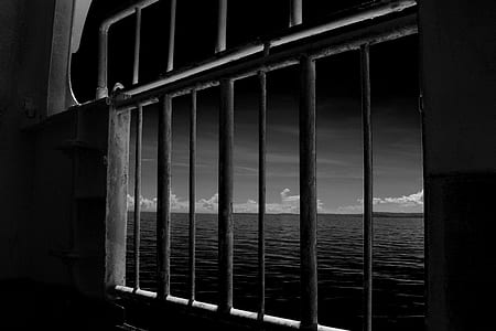 Grey Metal Frame Window Near Body Of Water thumbnail