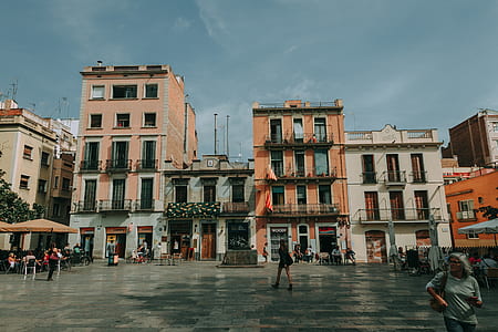 People Standing Near Concrete Buildings thumbnail