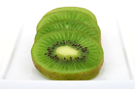sliced kiwi fruit on white surface thumbnail