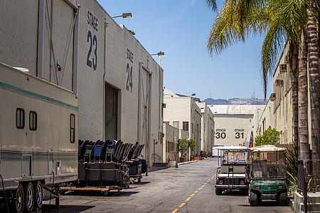 golf carts parked near concrete building during daytime thumbnail