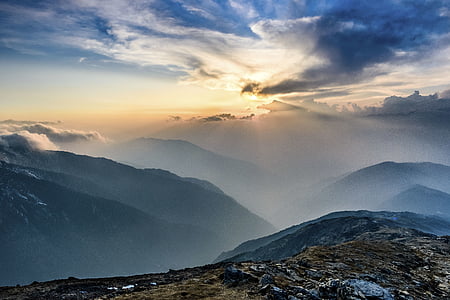 landscape photo of mountains under cloudy sky thumbnail