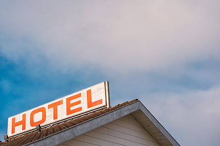beige house with hotel signage thumbnail