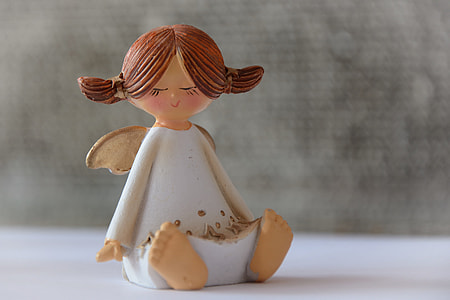 selective focus photography of white dressed angel  ceramic figurine thumbnail