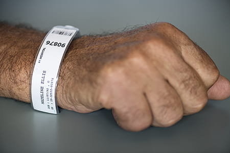 person's hand with hospital tag on his arm thumbnail