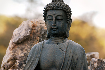 gray sitting Buddha close up photo thumbnail