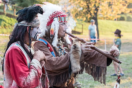 Two Native American Playing Wind Instrument thumbnail