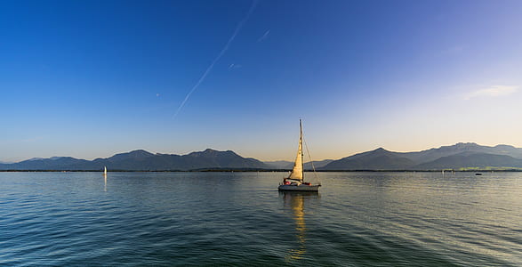 landscape photography sailboat on ocean during daytime thumbnail