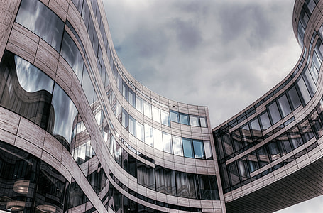 low-angle photograph of glass window on building thumbnail