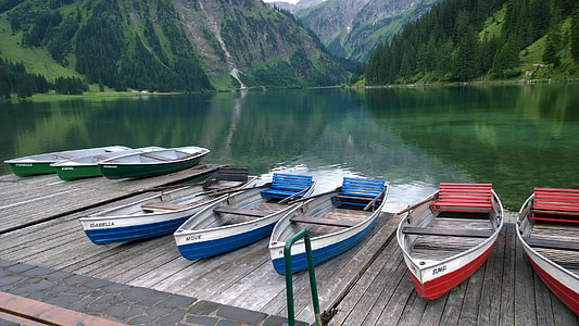 five red-white-and-blue fishing boats on wooden dock thumbnail