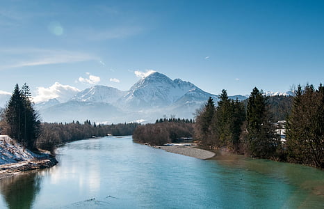 river surrounded by trees near to mountain thumbnail