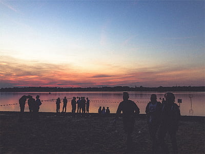 people in front body of water thumbnail